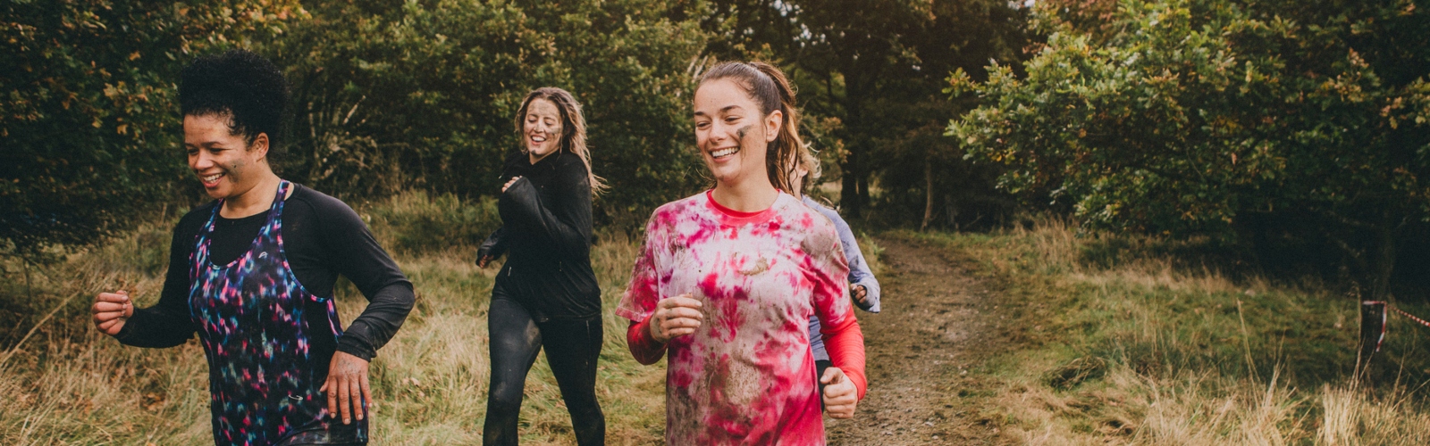 Three young women trail running