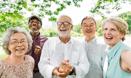 A group of older people, smiling